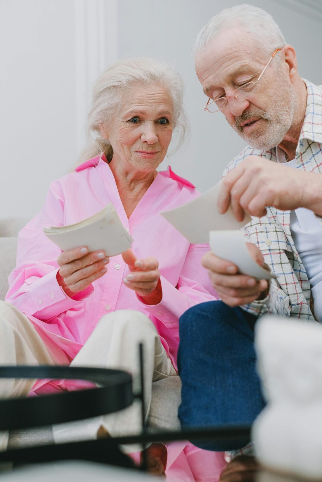 Elderly couple reviewing Medicare paperwork together
